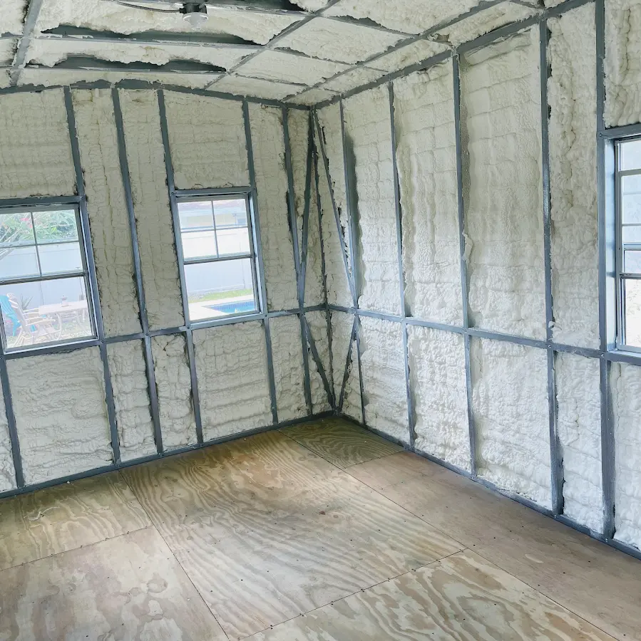 Closed-cell spray foam insulation applied to wall cavities in a residential project in Chenango